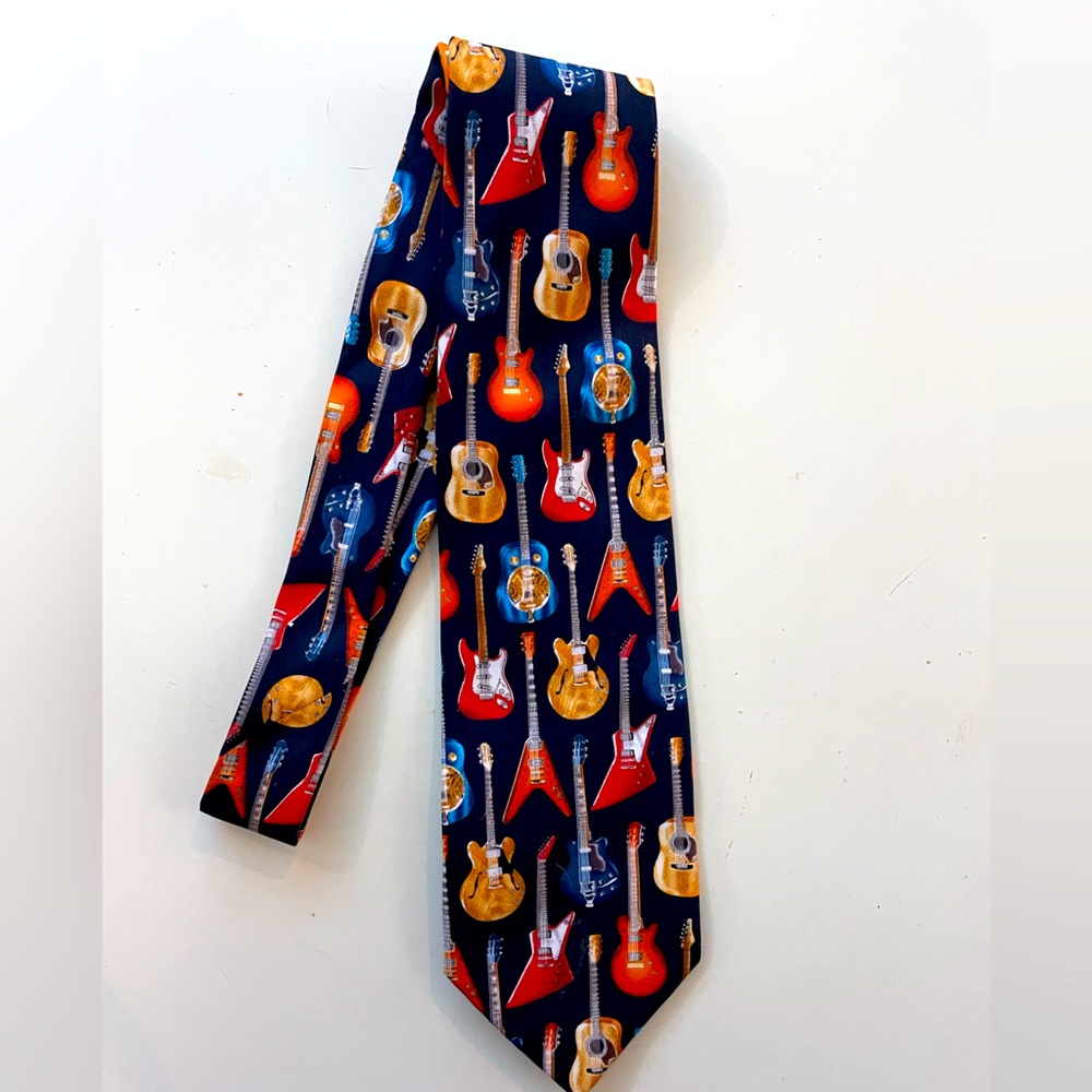 Men’s colorful tie with red blue yellow green guitars by Utopia.